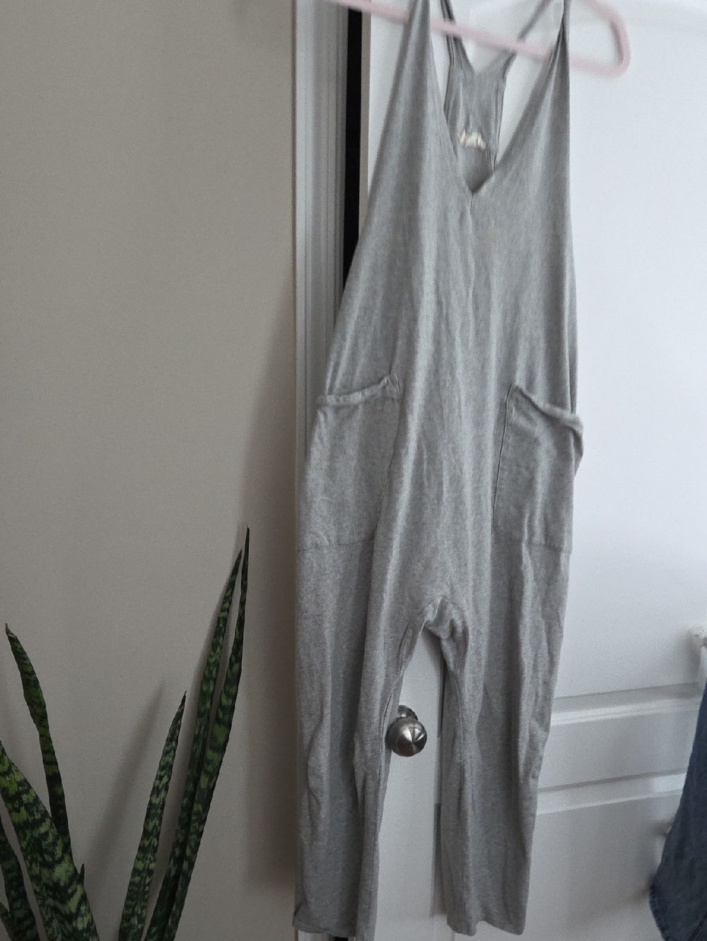 Sleeveless Light Gray Knit Jumpsuit with Front Pockets
